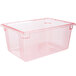 A Carlisle clear plastic food storage container with a red lid.
