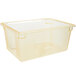 A yellow plastic Carlisle StorPlus food storage box with a clear lid.