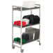 A Cambro Camshelving Premium drying rack filled with metal plates on a black coil shelf.
