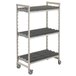 A grey metal Cambro Camshelving drying rack with wheels.