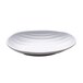 An Elite Global Solutions white melamine oval plate with wavy lines on it.