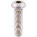 A white screw with a nut on a table.