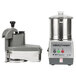 A Robot Coupe R401 commercial food processor with a stainless steel bowl and continuous feed.