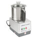 A silver and black Robot Coupe R401 commercial food processor with a lid.