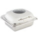 A silver square Bon Chef stainless steel container with a glass lid.