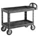 A black Rubbermaid plastic utility cart with wheels.