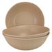 Two beige Elite Global Solutions Greenovations paper bag-colored round bowls sitting on a white surface.