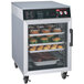A Hatco Flav-R-Savor holding cabinet with trays of food inside.