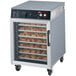 A Hatco Flav-R-Savor undercounter holding cabinet with trays of food inside.