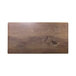 A rectangular faux walnut melamine serving board on a wood table.