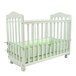 A white L.A. Baby Bedside Manor cradle.