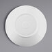 A white Elite Global Solutions round plate with a white rim.