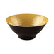 A yellow melamine bowl with a black pebble design and gold rim.
