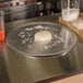 A dough ball on an American Metalcraft aluminum pizza pan.