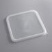 A translucent square plastic container with a translucent square lid.