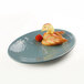 An Elite Global Solutions oval platter with fruit on it.