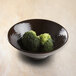 An Elite Global Solutions Aubergine-colored melamine bowl filled with broccoli.