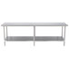 A long stainless steel Advance Tabco work table with a stainless steel undershelf.