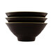 Three black Elite Global Solutions bowls with yellow rims stacked on a white background.