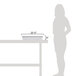 A woman standing next to a white GET Full Size Melamine food pan on a counter.