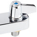 A chrome Equip by T&amp;S deck mount faucet base with blue handles.