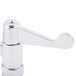 A silver Equip by T&S deck mounted faucet with wrist handles and a red button.