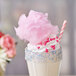 A milkshake with pink cotton candy and sprinkles made using Great Western Pink Bubble Gum Cotton Candy Sugar.