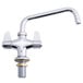 A silver Equip by T&S deck mount faucet with lever handles and a swing nozzle.