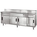 A stainless steel Advance Tabco commercial kitchen counter with 2 drawers and 4 sliding doors.