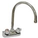 A chrome Advance Tabco wall mount faucet with knobs.