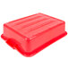 A red Vollrath Traex plastic drain box with a handle.
