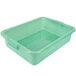 A Vollrath green plastic container with handles and holes.