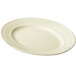 A white platter with a ribbed edge.