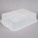 A clear plastic Vollrath Traex drain box with a lid.
