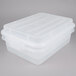 A white Vollrath plastic container with a snap-on lid.