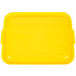 A yellow plastic Vollrath Traex lid for a rectangular food storage box with black lines.