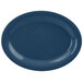 A blue oval platter with a white surface and speckled rim.