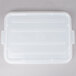 A clear plastic Vollrath Color-Mate lid on a white plastic container.