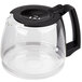 A clear glass Proctor Silex coffee pot with a black lid and handle.