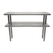 A stainless steel Advance Tabco double deck overshelf on a metal table.
