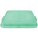 A Vollrath green plastic lid for a food storage box.