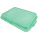 A Vollrath green plastic lid for a food storage box.