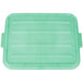 A Vollrath Traex green plastic lid with raised snaps for a food storage container.