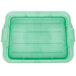 A green Vollrath Traex plastic lid with raised lines and handles.