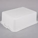 A white plastic Vollrath food storage container with a lid.