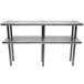 A stainless steel double deck overshelf on a table.