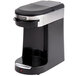 A black and silver Hamilton Beach single serving pod coffee maker on a counter with a lid.