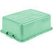 A Vollrath Traex green polypropylene container with a lid.