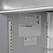 A Beverage-Air worktop refrigerator with a label on the metal door.