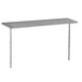 A silver stainless steel table with a long metal shelf attached underneath.